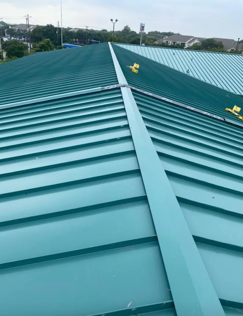 Green commercial metal roof ridge and valley for Metal Roof Repair in Avon